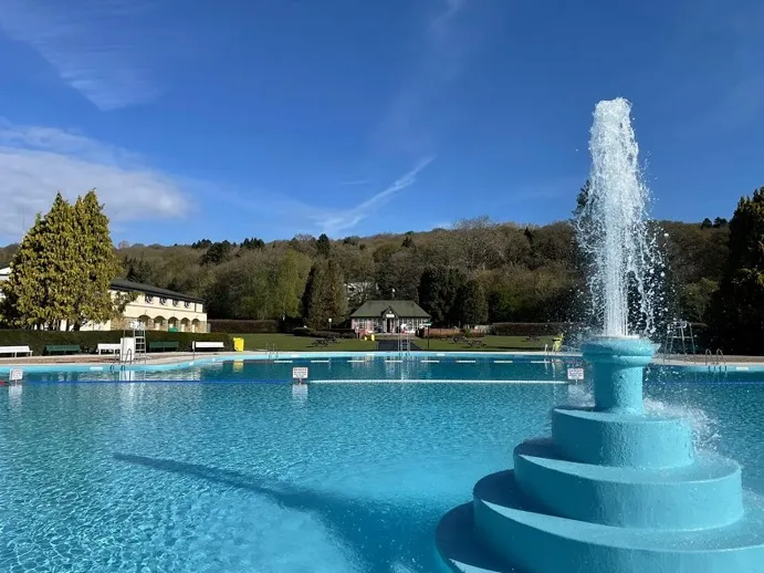 View of the fountain in the open air pool at Ilkley Lido, West Yorkshire