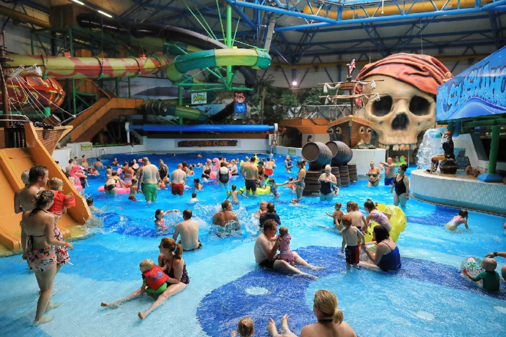 people enjoying the wave pool and lsides at Calypso Cove splash and swimming pool in Barnsley