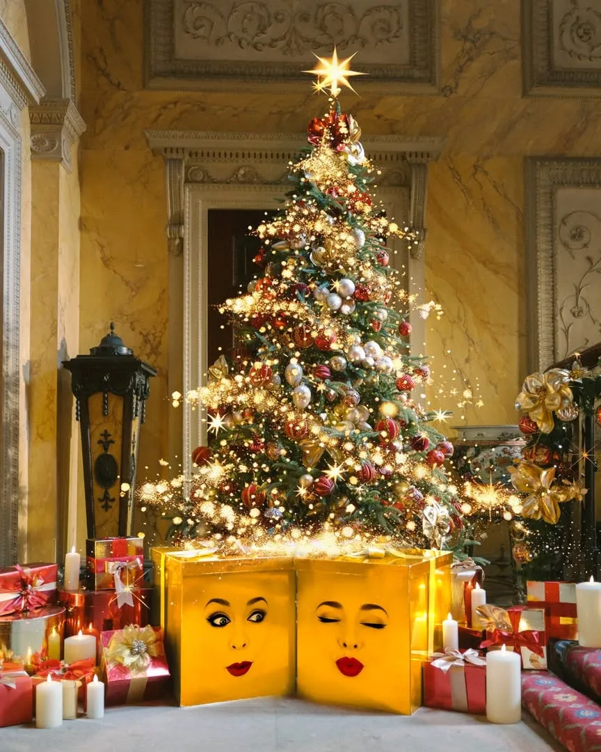 Decorated Christmas tree with two yellow presents with faces, part of the Magic at the Mansion Christmas event at Harewood House