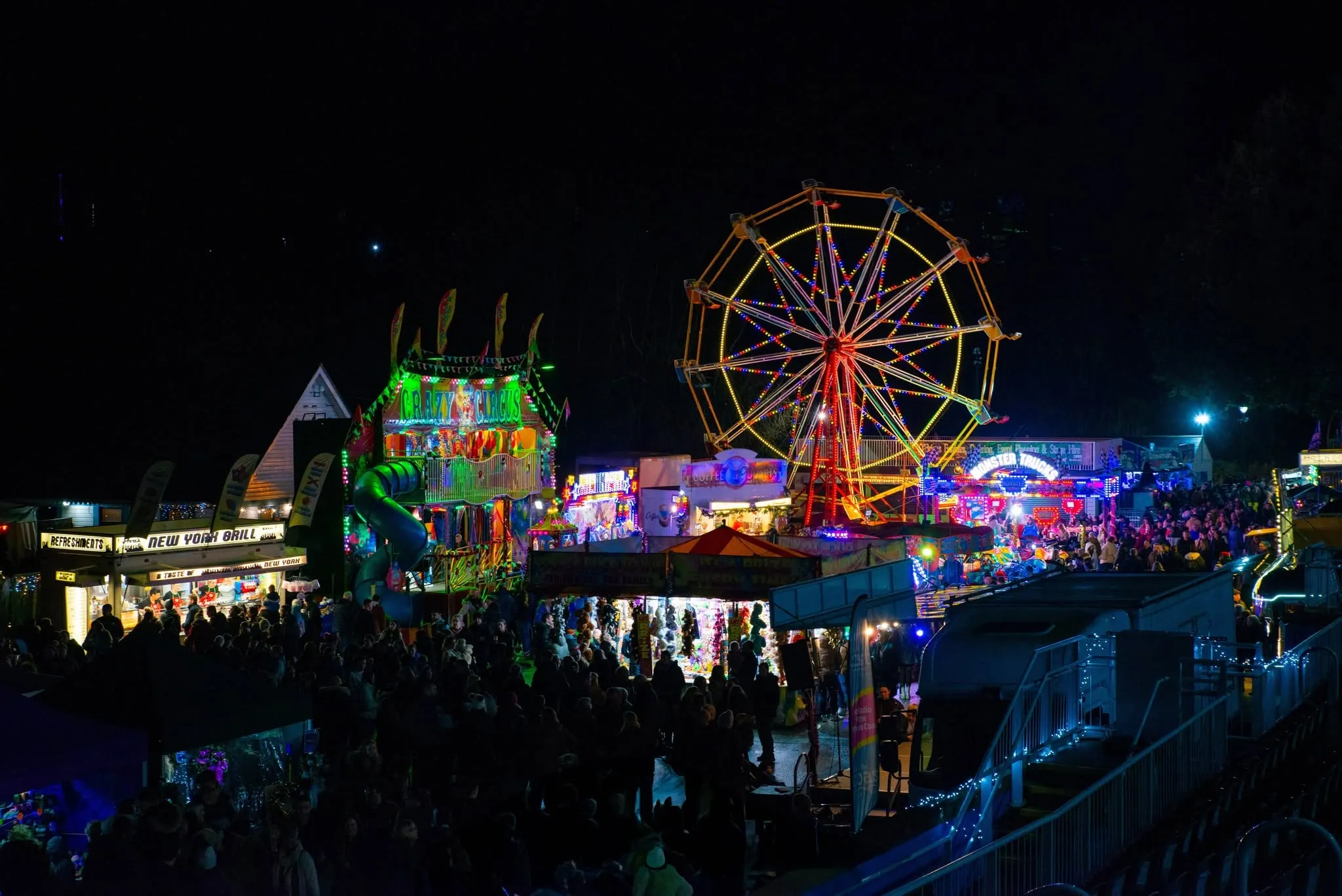 Scarborough Sparkle Christmas market illuminated stalls and festive crowds at the Open Air Theatre