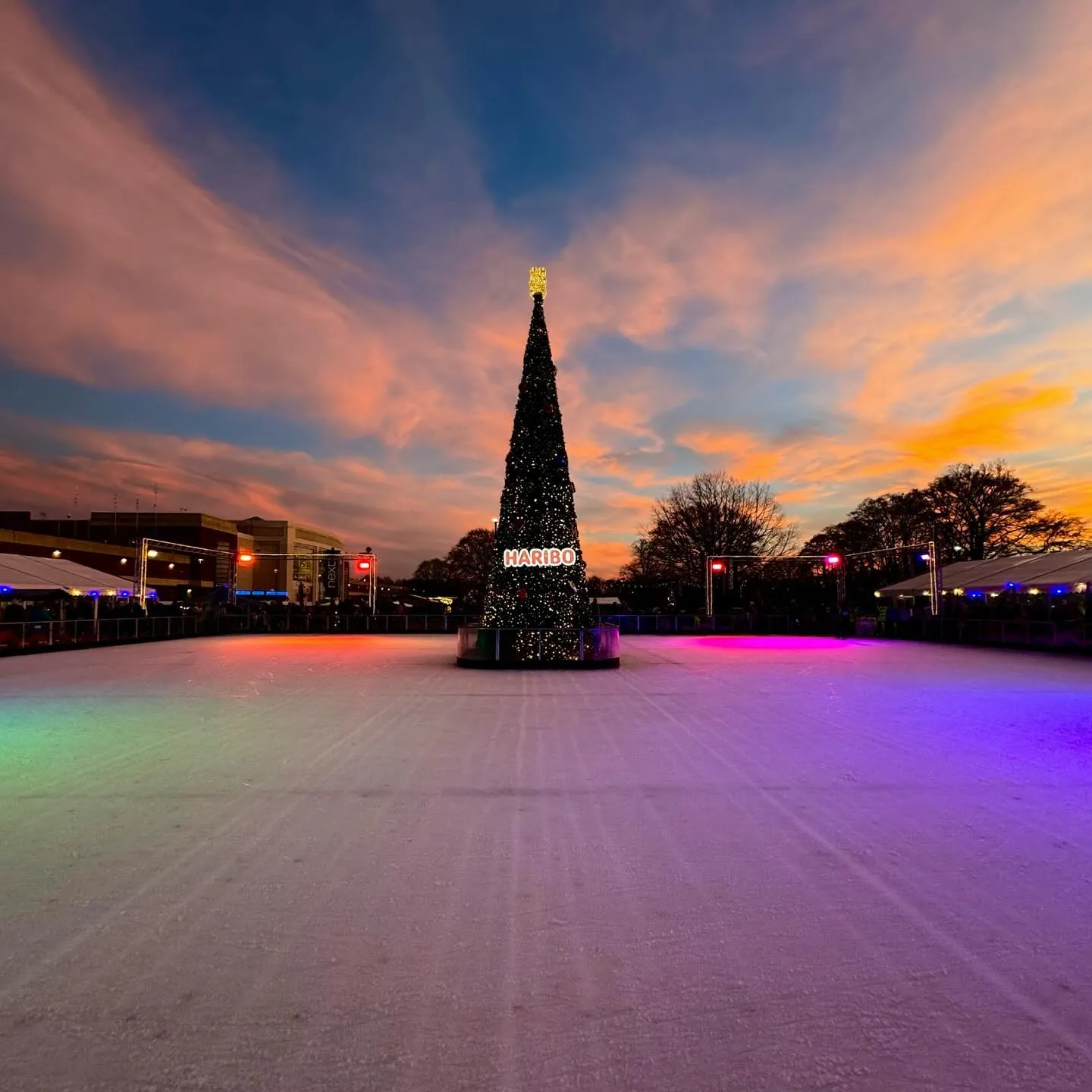 Skaters enjoying the outdoor ice rink around the giant illuminated Christmas tree at Yorkshire's Winter Wonderland in York