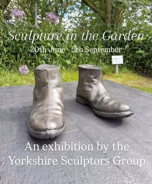Sculpture of a pair of boots, part of Sculpture in the garden exhibition at Helmsley walled garden for summer 2026