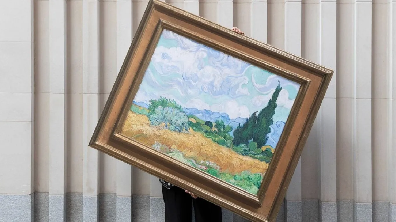 person holding a copy of a print of a painting from The National Gallery, part of OAkwell HAll COuntry PArk Art on your doorstep event running from April to September 2026