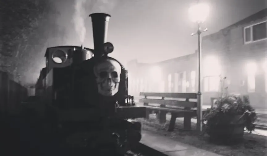 Whistlestop Valley heritage steam train illuminated for the Halloween Ghost Train event