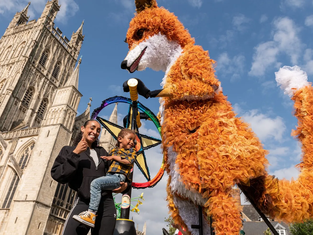 Giant Fox puppet on a scooter, part of Bradford Festival event in July 2026