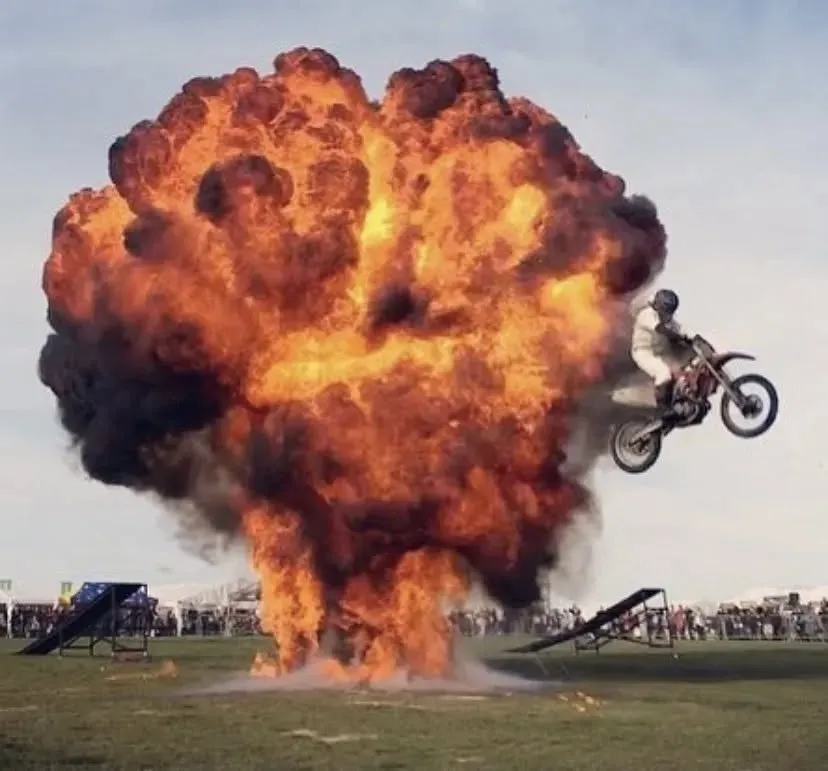 Stunt Motorbike emerging through a ball of fire