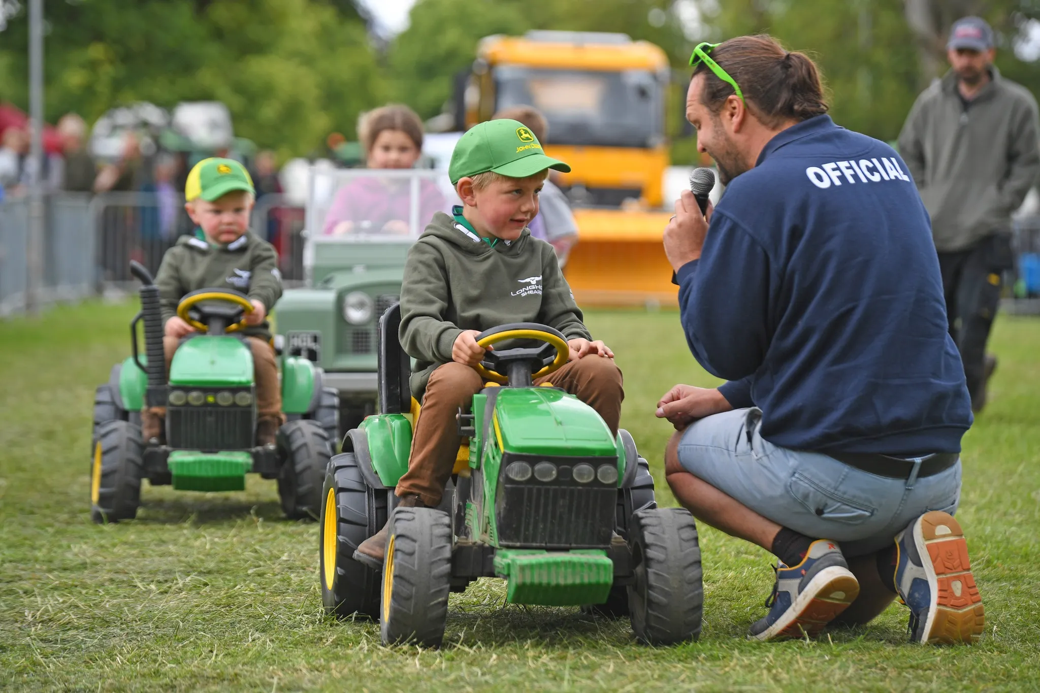 Children on ride along tractors at Tractor Fest at Newby Hall