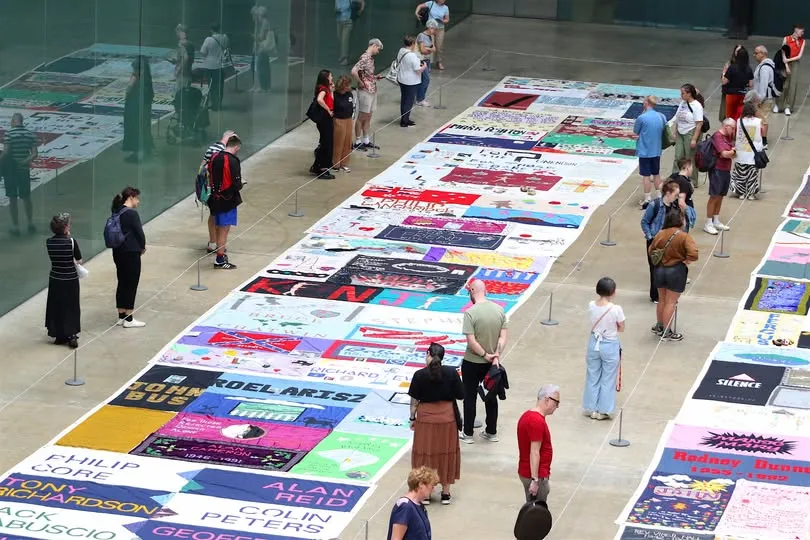 People viewing the AIDS Memorial quilt, whihc will be on display in Wakefield in June