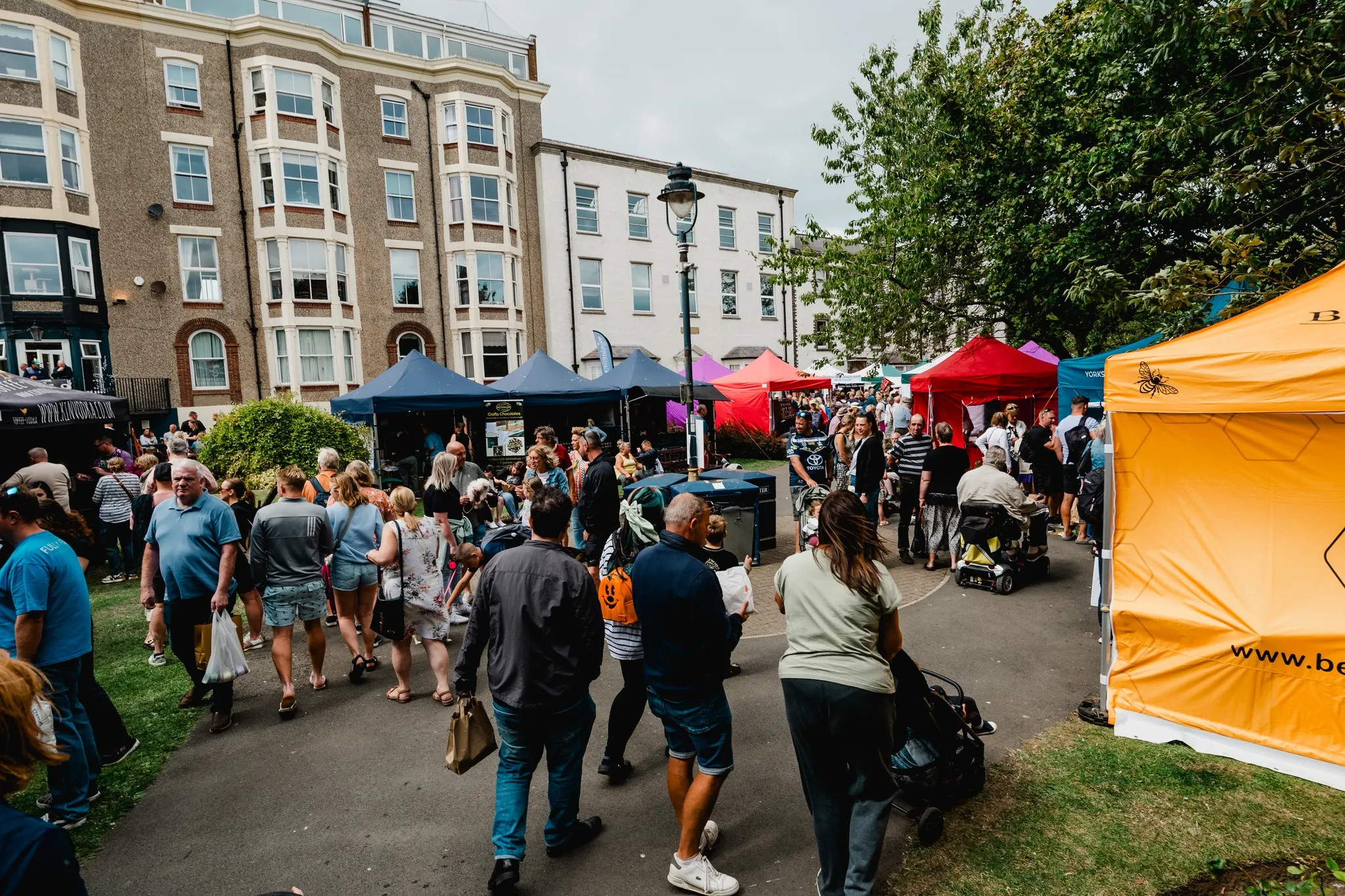 crowds of peopel enjoying the Filey Food Fesstival which takes in and outside the Evron Centre