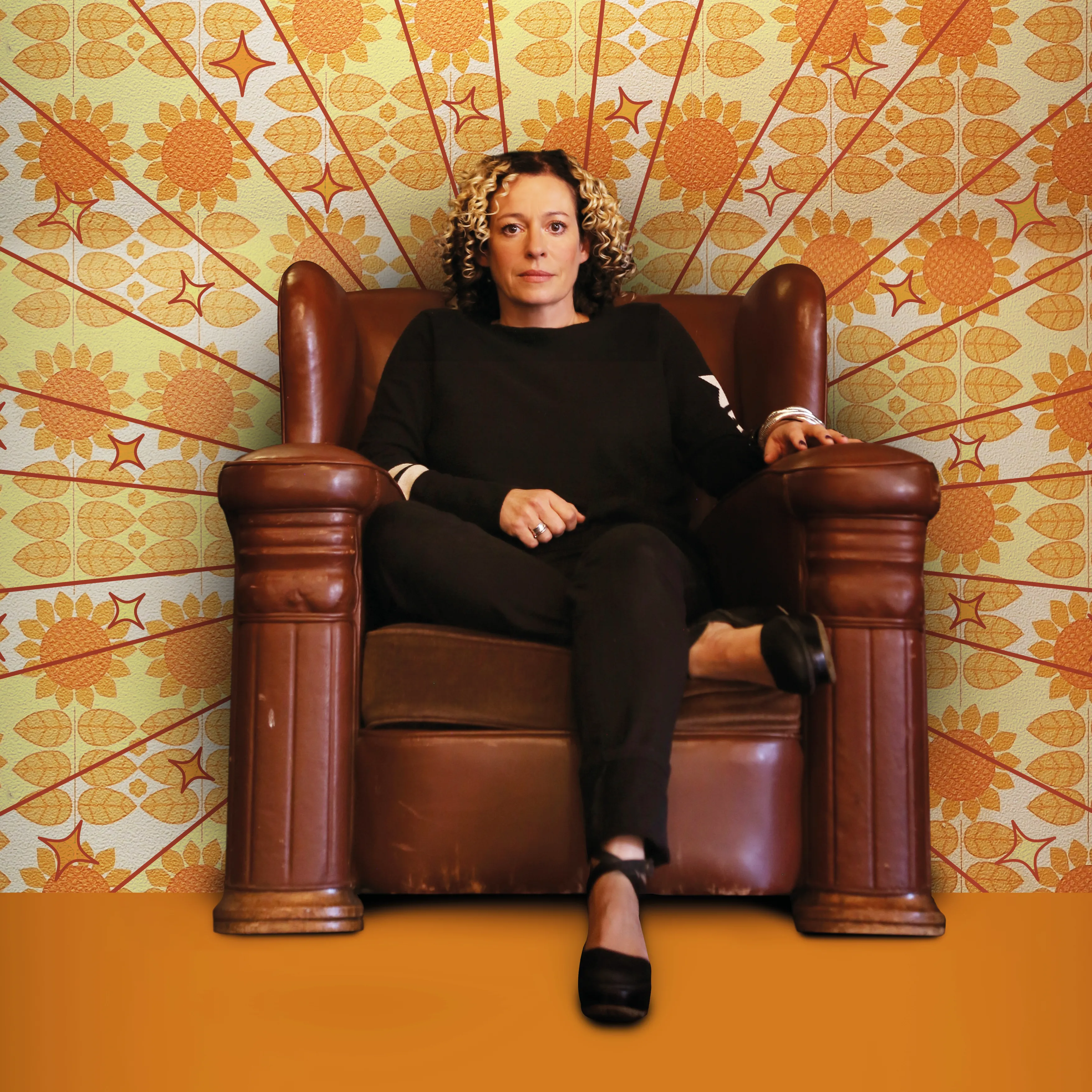 KAte Rusby sitting in a large armchair, headliner for the Barnsley Folk Festival in May 2026