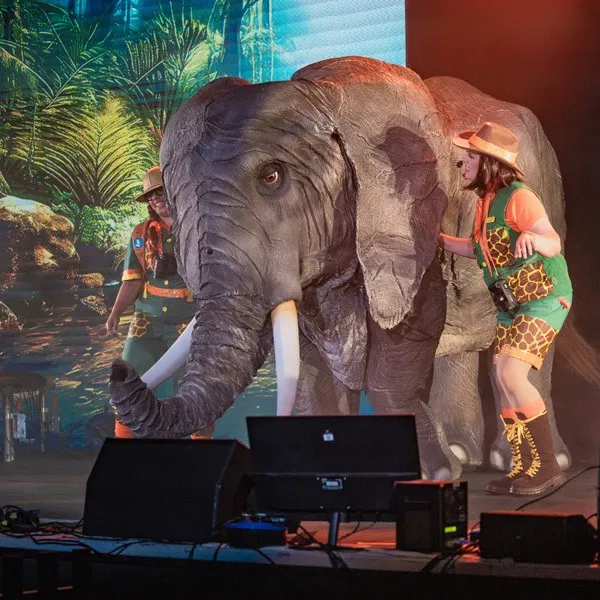 two people and almost lifesize puppet elephant on stage fr the safari express may half term event at Embsay and Bolton Abbey Railway