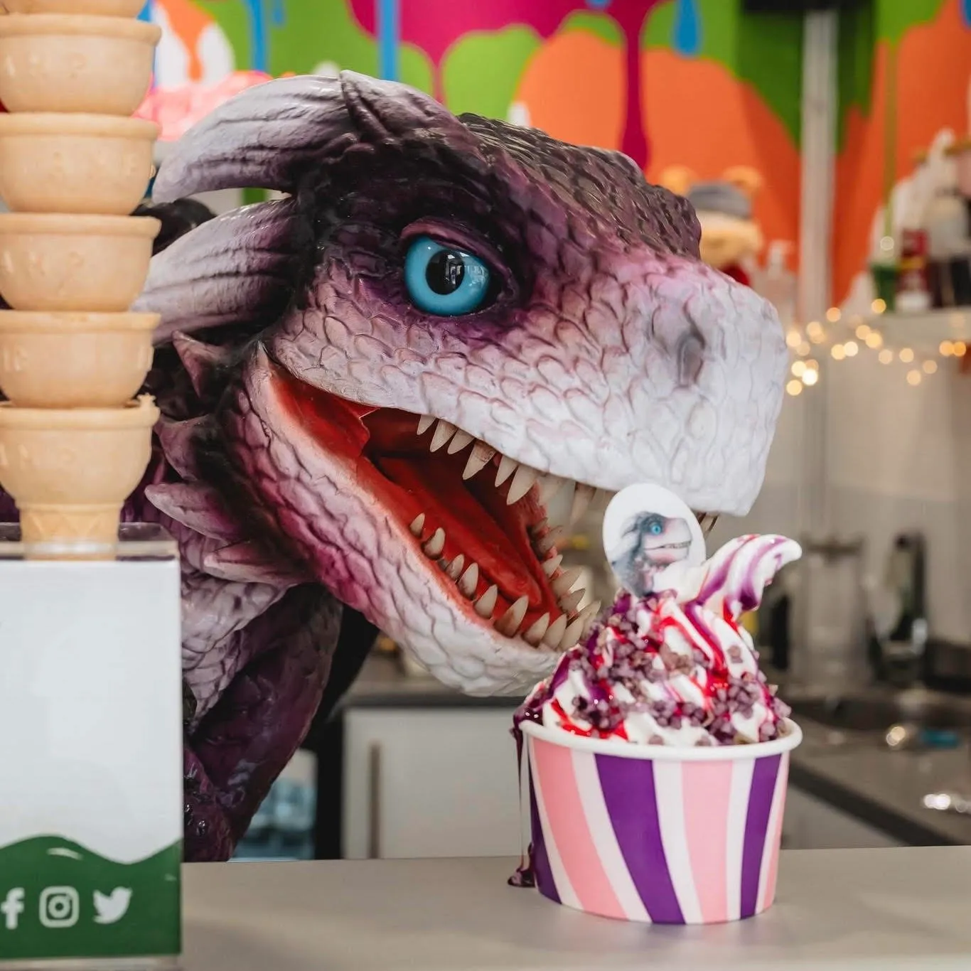 Iggy the dragon with a loop scoops ice-cream cone at Wizardfest in York during may half term