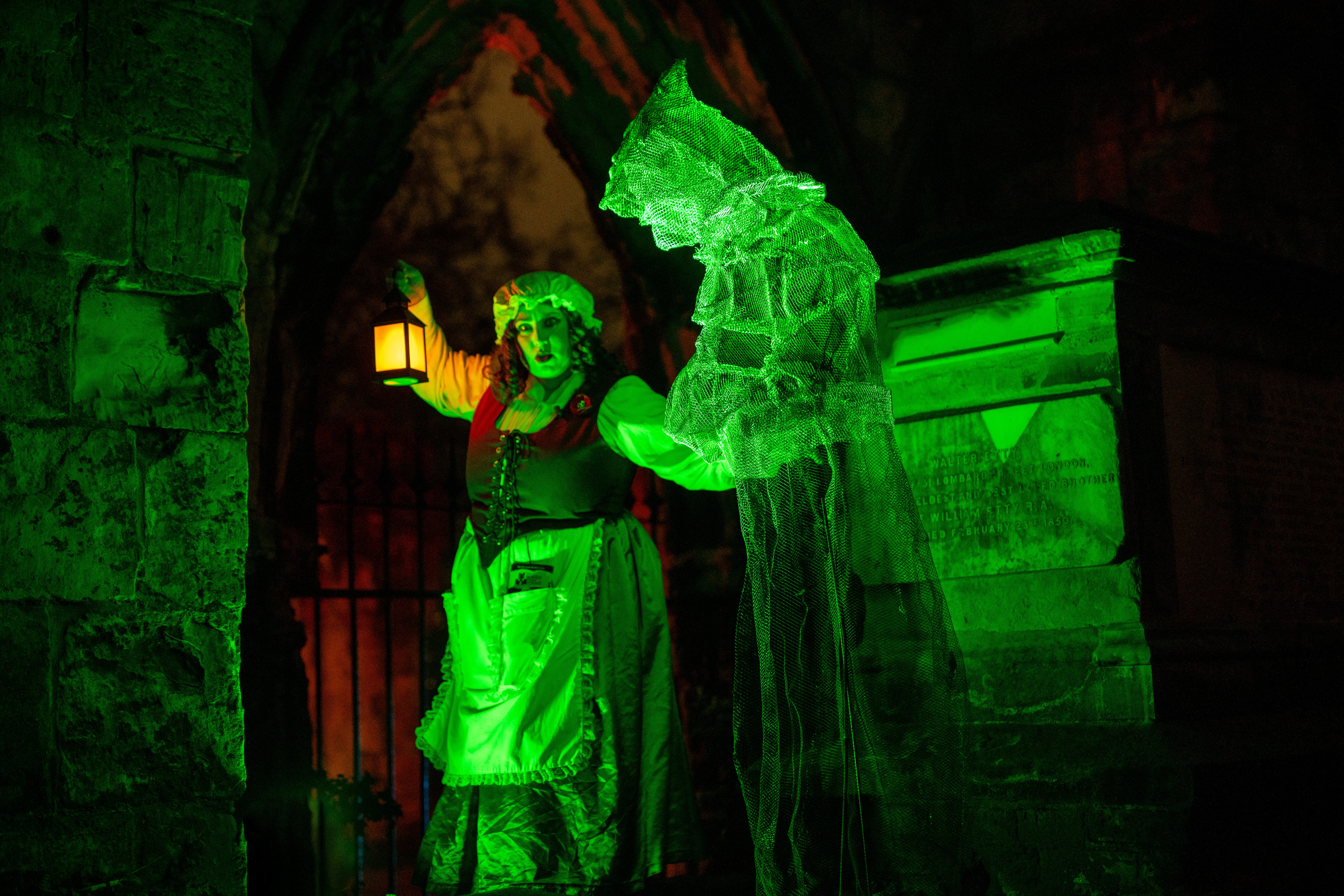 Illuminated ghost sculpture with Mad ALice Tour guide and story teller of  York