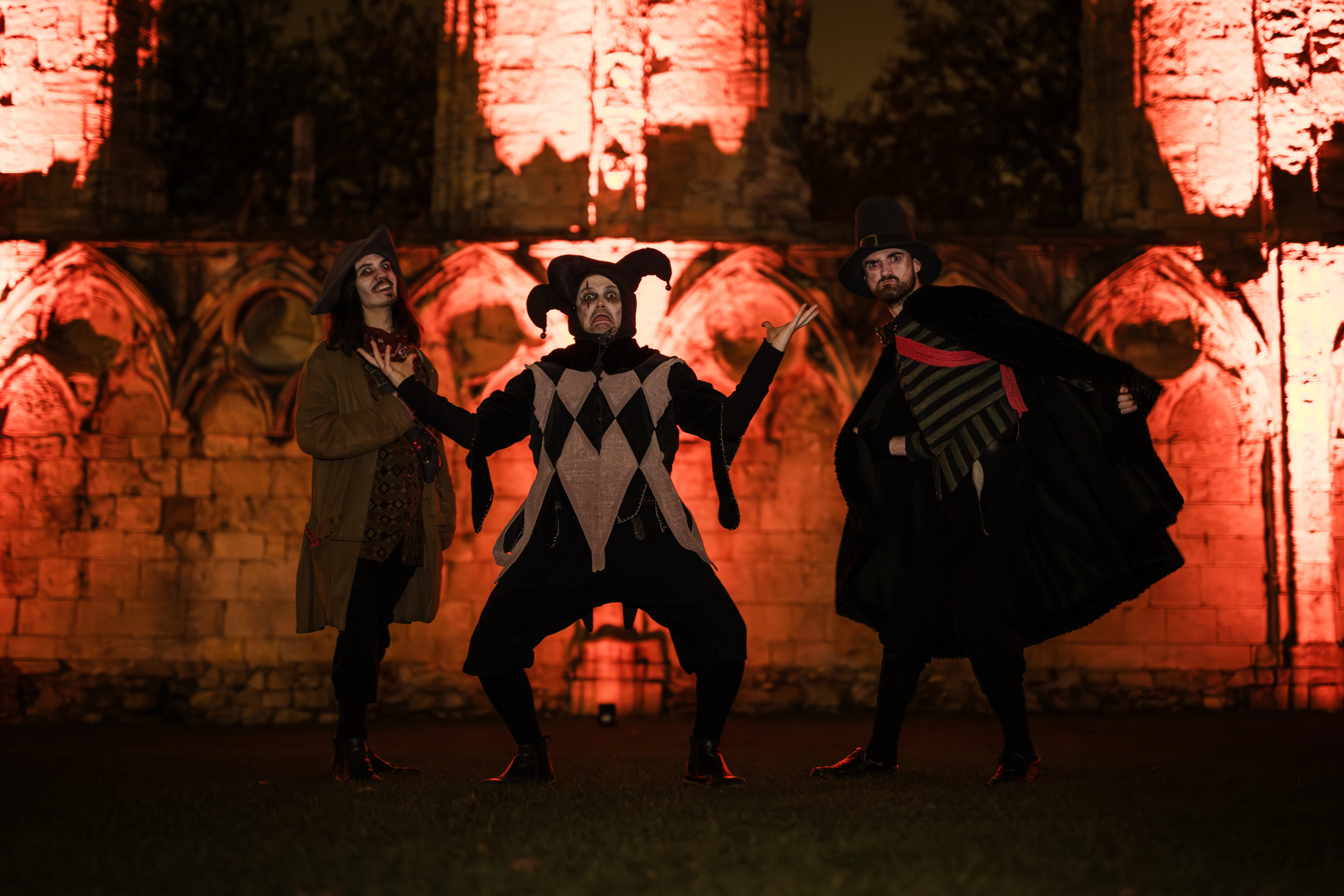 Ethereal wire mesh ghost sculptures illuminated in York Museum Gardens at night