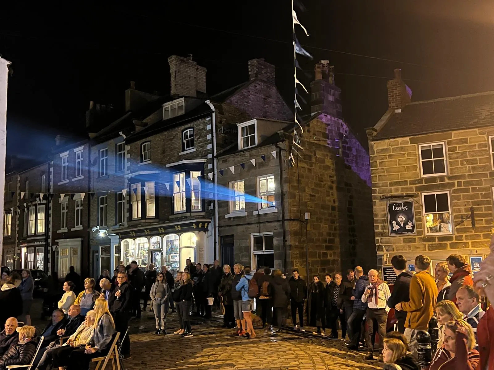 Evening outdoor gathering at Staithes Festival of Arts and Heritage