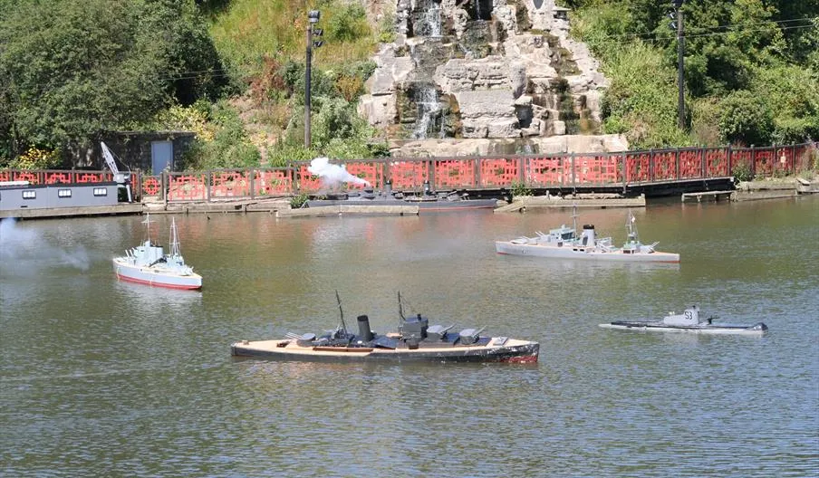 Peasholm PArk lake with boats on the water during the naval warfare battle held over the summer in the park. 
