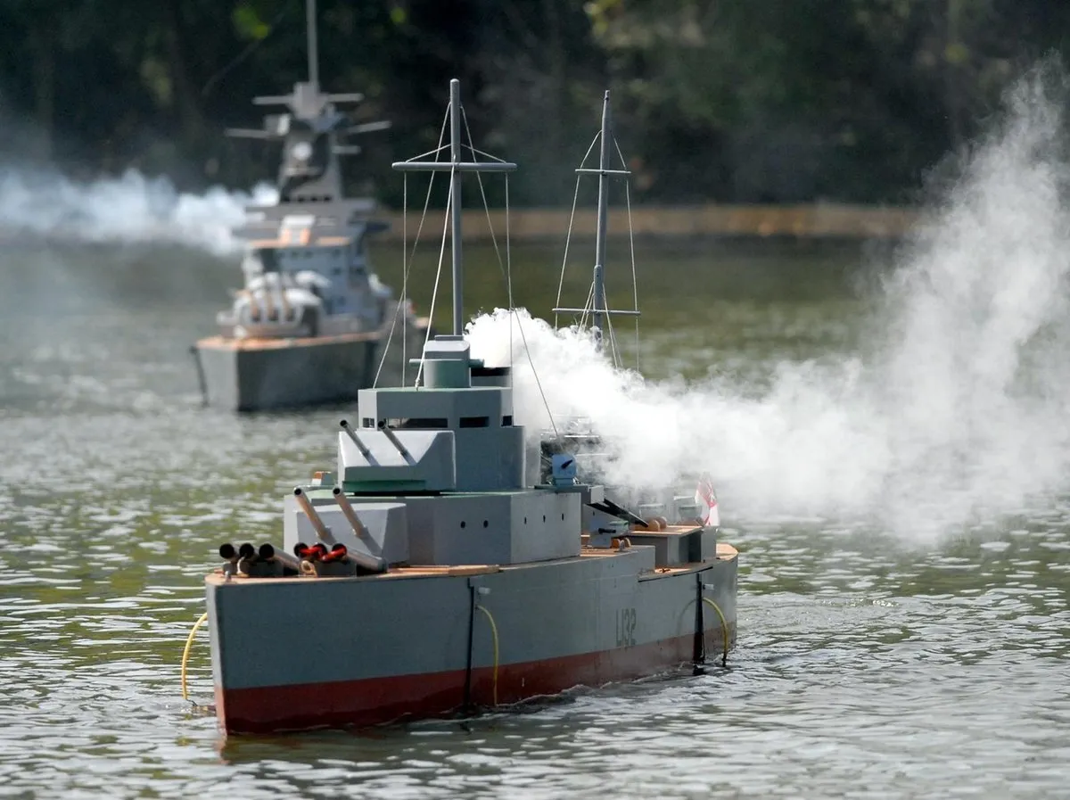 Peasholm park naval warfare boat, with smoke pouring out as the battle progresses for the crowd