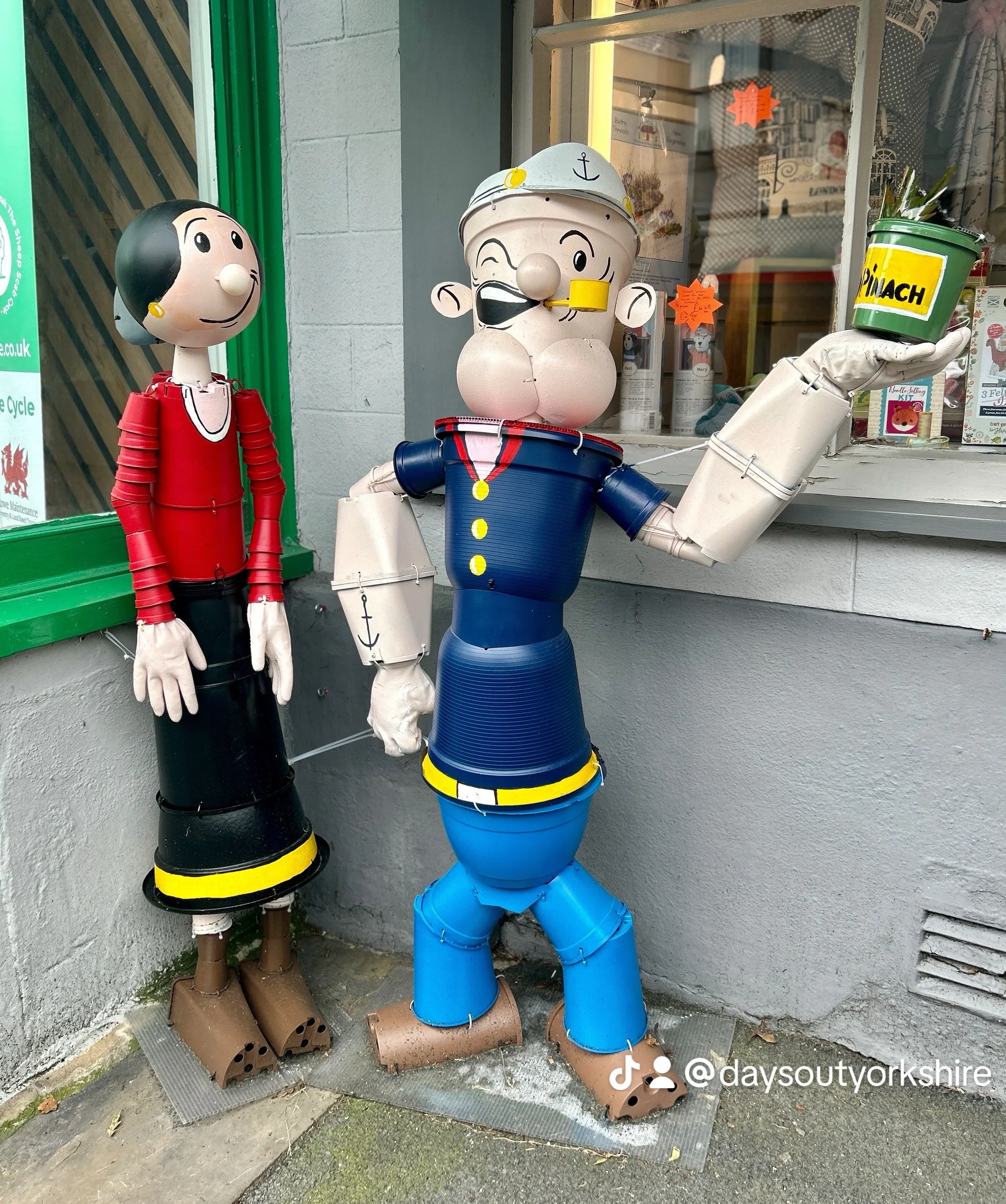 Popeye and Olive made of flowerpots at the free summer flowerpot trail in Settle, Yorkshire Dales