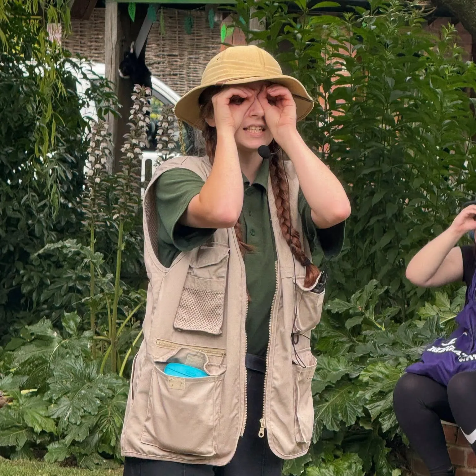 person in a safari style costume entertaining families, part of the Tropical Butterfly House Summer Treasure Trail event 