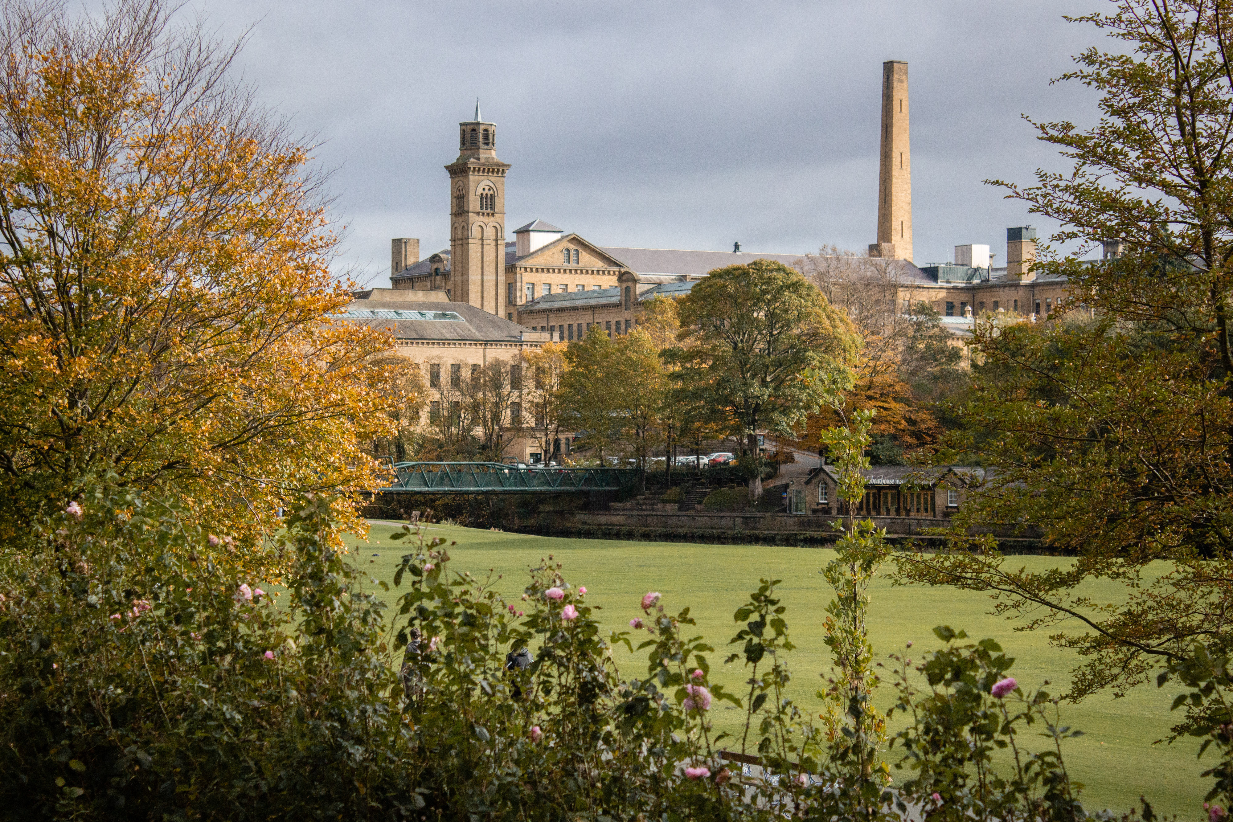 View over Roberts Park with Salts Mill in the background