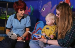 Child, parent and Deep staff playing together