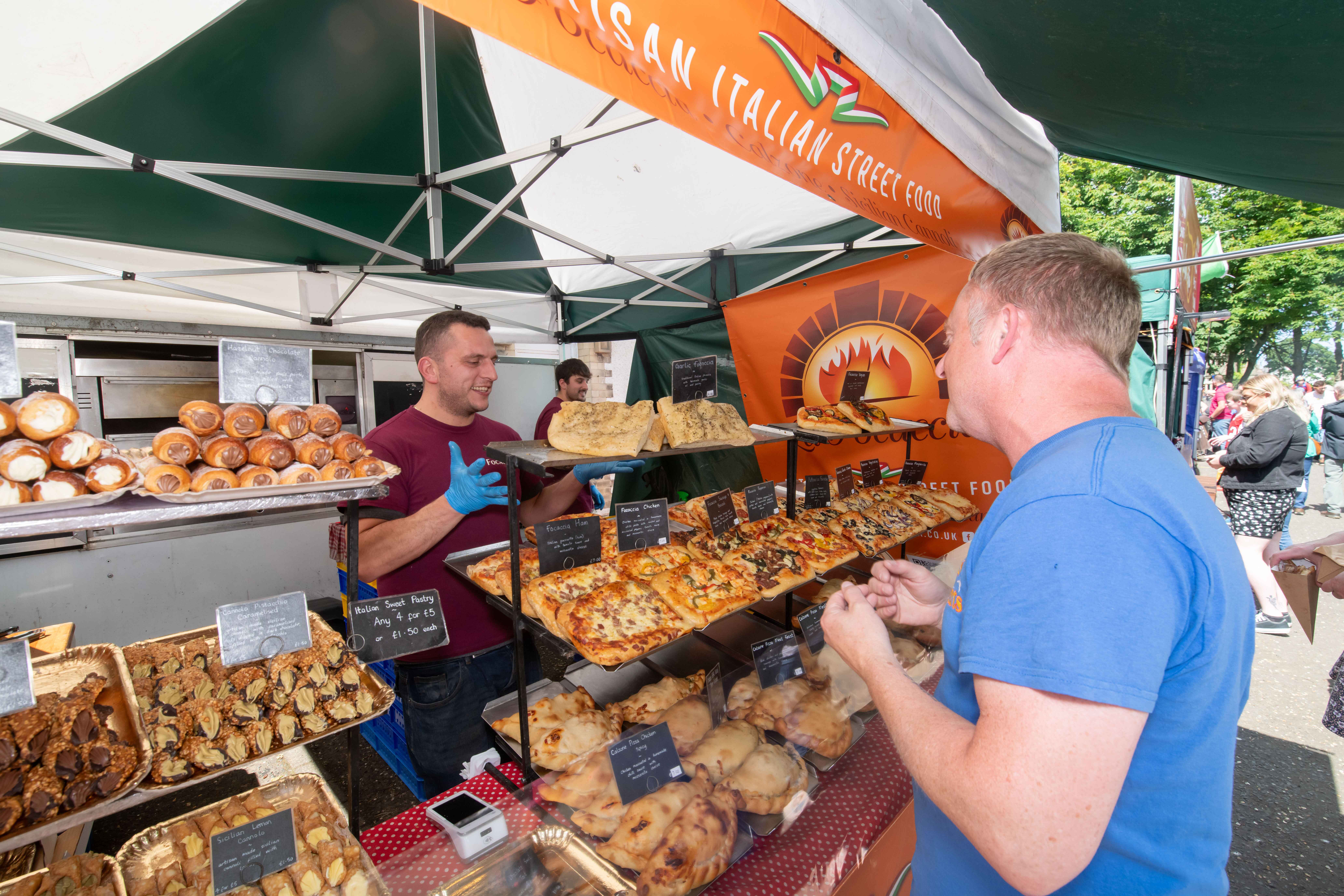 shopper at a pastry stall at Filey Food Festival