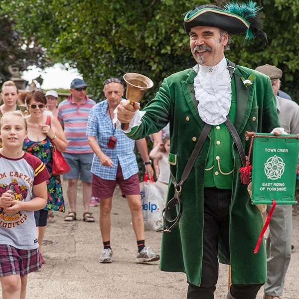 Town Crier leading a group of visitors at Sewerby Hall