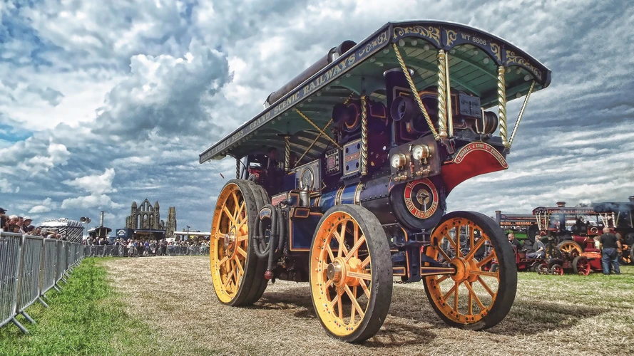 Taction Engine with Whitby Abbey and crowds of people behind at the Whitby Traction Engine Rally in August 2026