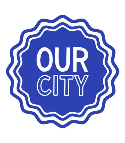 Blue rosette with Our City in White text in the centre 
