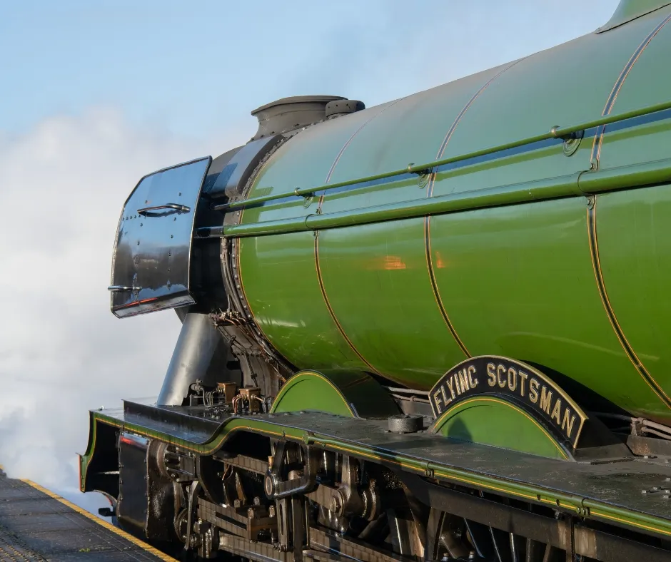 Flying Scotsman nameplate against the green body of the engine, part of the trains visit to the National Railway Museum.